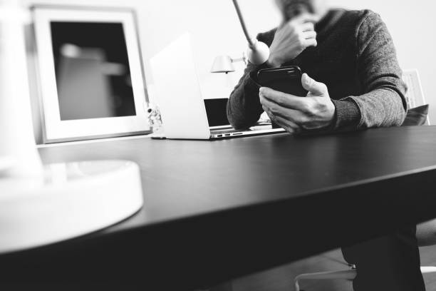 istock businessman working with smart phone and digital tablet and laptop computer in modern office 917303258
