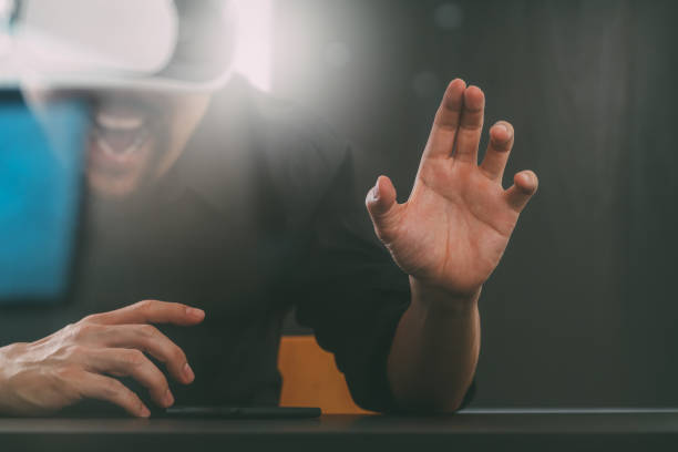 istock businessman wearing virtual reality goggles in modern office with mobile phone using with VR headset 917306904