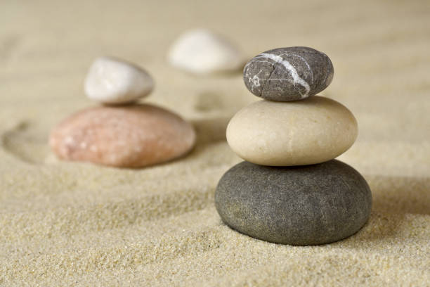 istock Pile of balanced stones on sand 917321502