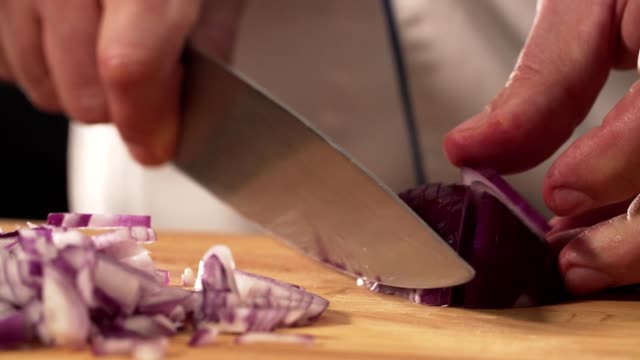 Chef cutting onion