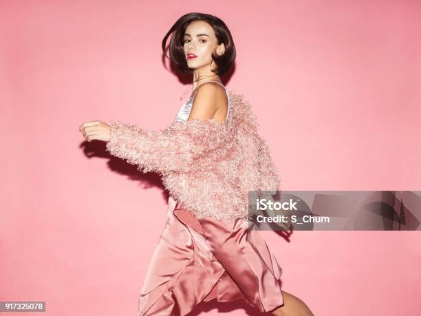 Fashionable Woman In Pink Dress On Pink Background Stock Photo - Download Image Now - Fashion, Fashion Model, One Woman Only