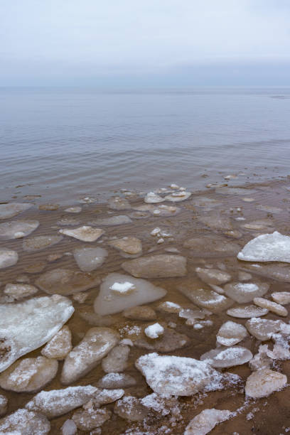 istock Frozen ice crystals on the sea beach 917325656