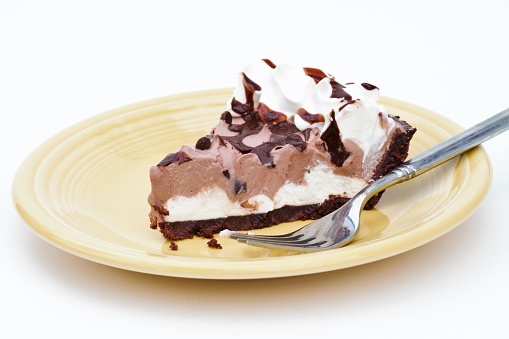 Cream pie dessert on saucer with fork