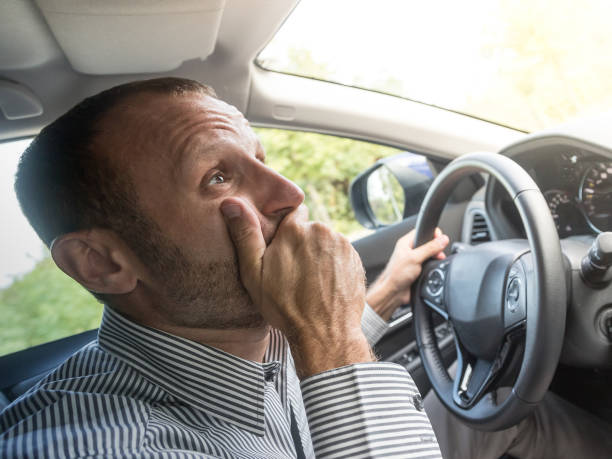 istock Stressed and annoyed male driver on the road during the rush hour 917339098