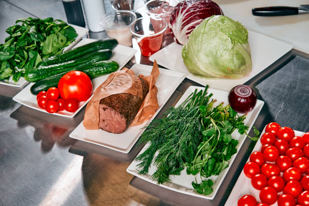 istock meat with vegetables and herbs on the cook's table 917339714