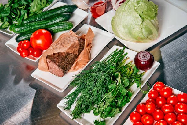 istock meat with vegetables and herbs on the cook's table 917339726