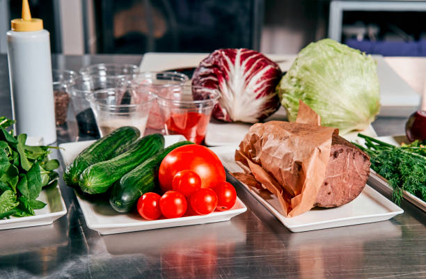 istock meat with vegetables and herbs on the cook's table 917339804
