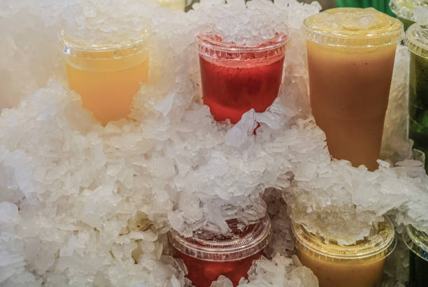 istock fruit juices in plastic take away glasses under ice cubes 917339950