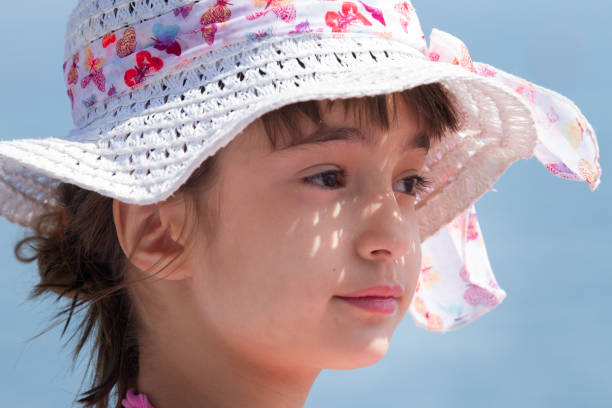 istock Little girl with white hat 917339970