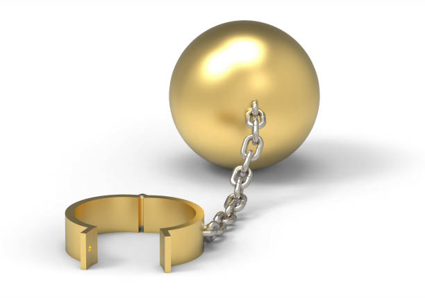 Golden cuffs and weight ball and platinum chain. Slave of wealth concept. 3d illustration