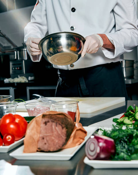 istock meat with vegetables and herbs on the cook's table 917340398