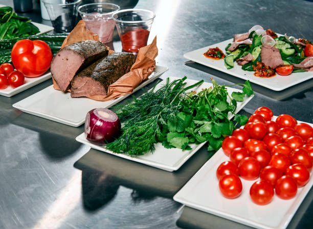 istock meat with vegetables and herbs on the cook's table 917340448