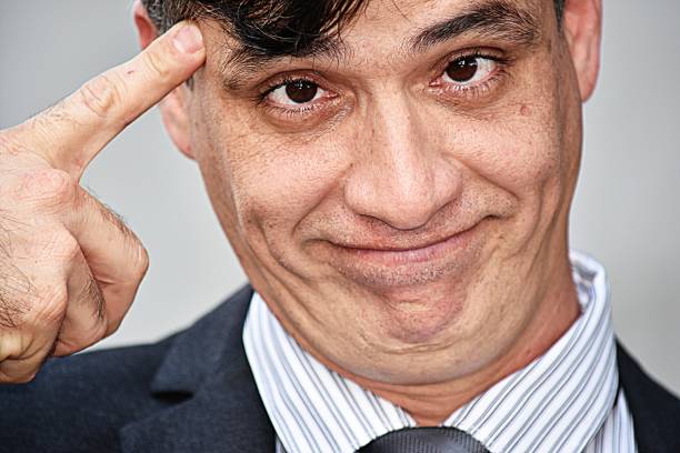 istock Intelligent Hispanic Business Executive Wearing Suit 917340798