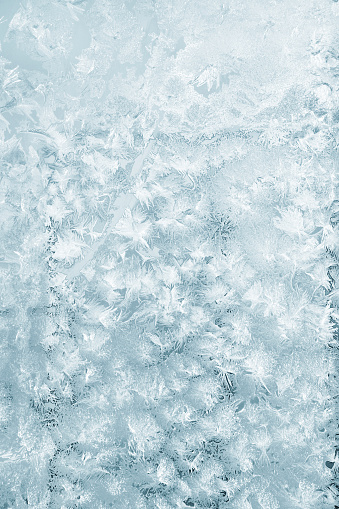 frost and crystals of ice on a window