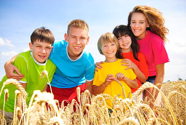 Cousins in wheat field stock photo