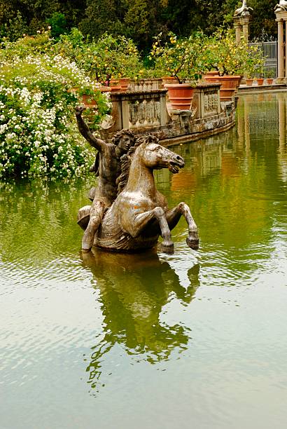 Neptune statue on the Neptune fountain in Florence from behind. The Fountain of Neptune is situated in the Piazza della Signoria in front of the Palazzo Vecchio. The fountain was commissioned by Cosimo I de' Medici in 1559.