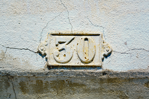 metal house number thirty (30)