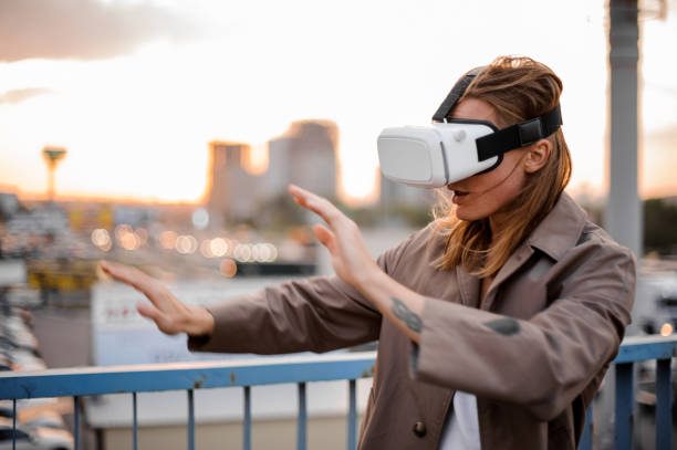 istock Young long-haired man wearing virtual reality glasses 917359076