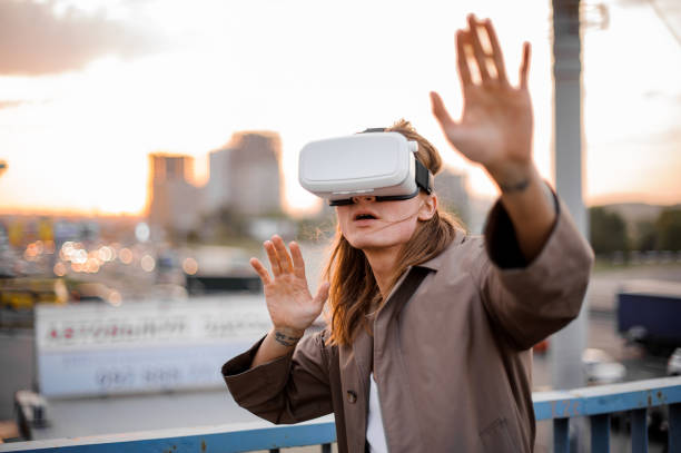 istock Young long-haired guy enjoying virtual reality glasses 917359182