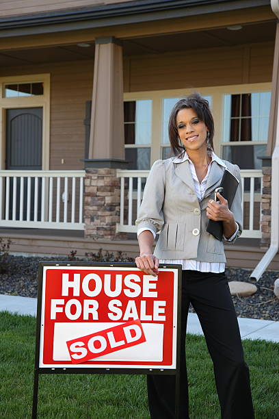 istock Real estate agent in front of home 91736156
