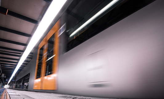 Fast train arriving to or departing from the station in Sydney, Australia