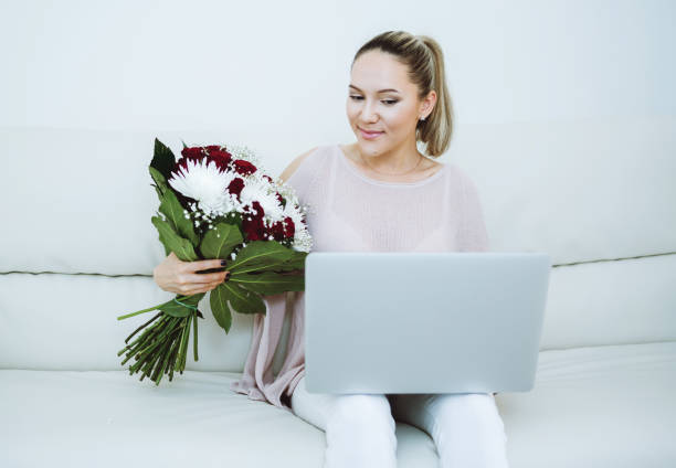 istock Woman holding flowers bouquet 917378620