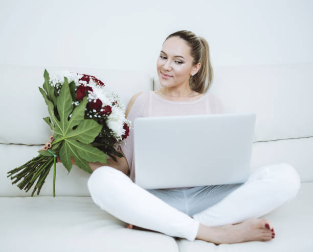 istock Woman holding flowers bouquet 917378626