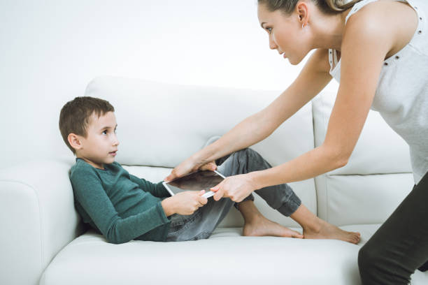 istock Game addiction Problems kids with smartphones and tablets 917378690