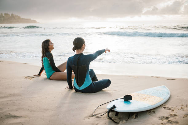 istock Two young female surfers resting 917379526