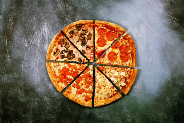 istock Slices of pizza with different fillings on a dark textured background 917379552