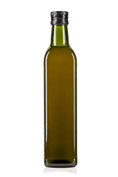 Photo of a bottle of olive oil isolated on a white background.