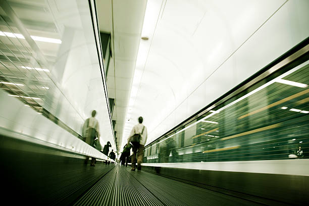 istock commuter walking on a moving walkway in tokyo, japan 91738096