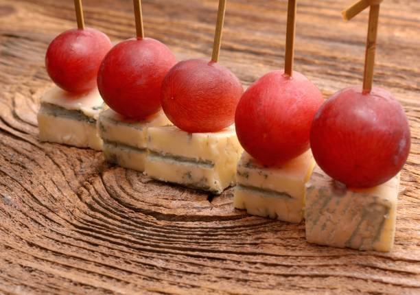istock pieces of blue cheese and red grapes 917383234