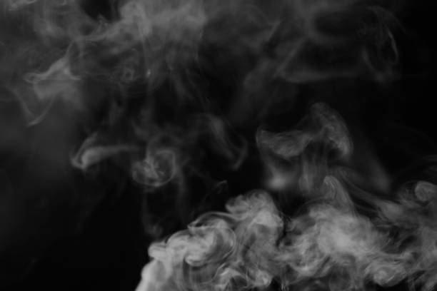 istock White smoke on a black background. Texture of smoke. 917384432