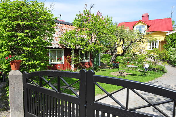 vintage wooden fence and small wicket in reconstruction of ukrainian village of 19th century