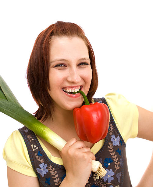 Cтоковое фото Женщина ест овощи