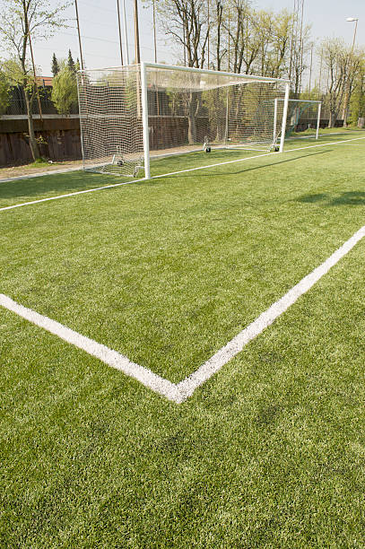 Football area with stripes on grass stock photo