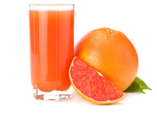 istock healthy food. grapefruit juice with sliced grapefruit isolated on white background 917390618