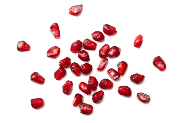 istock pomegranate seeds isolated on white background. top view. pomegranate berries. 917391194