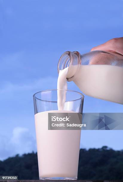 Pouring Milk Stock Photo - Download Image Now - Bottle, Breakfast, Color Image