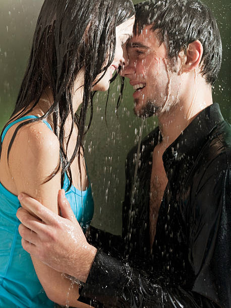 istock Young happy couple hugging under a rain 91739528