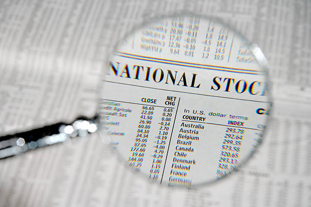istock Magnifying glass over business section 91740299