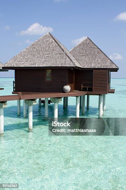 Bungalows In Tropical Beach Stock Photo - Download Image Now - Above, Building Exterior, Built Structure