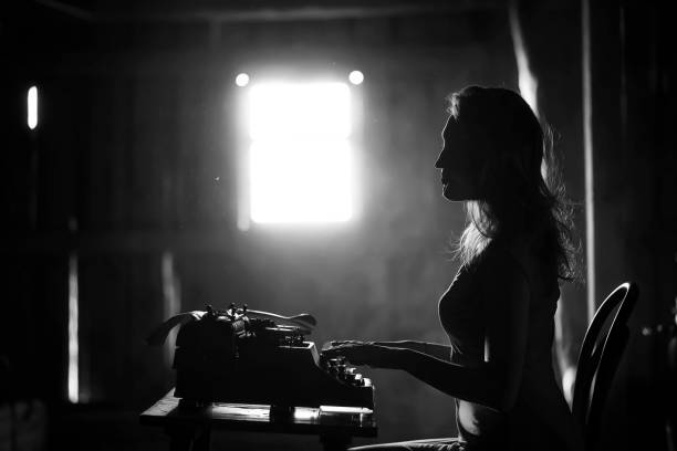 istock A girl prints on an old typewriter 917403750