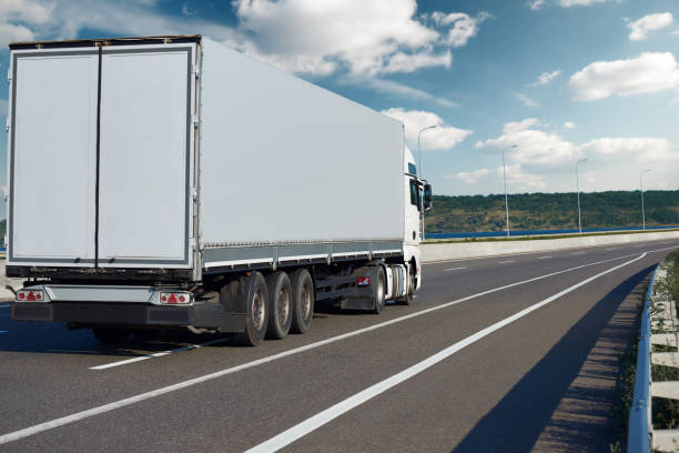 istock one truck with container on road, cargo transportation and shipping concept 917404738