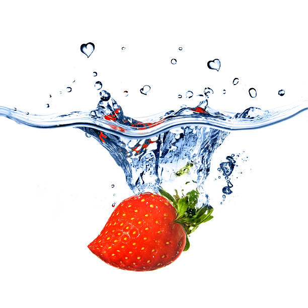 istock heart from strawberry dropped into water 91740479