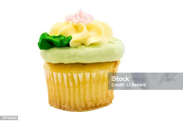 Cupcake With Green Pink And Yellow Frosting Isolated On White Stock Photo - Download Image Now