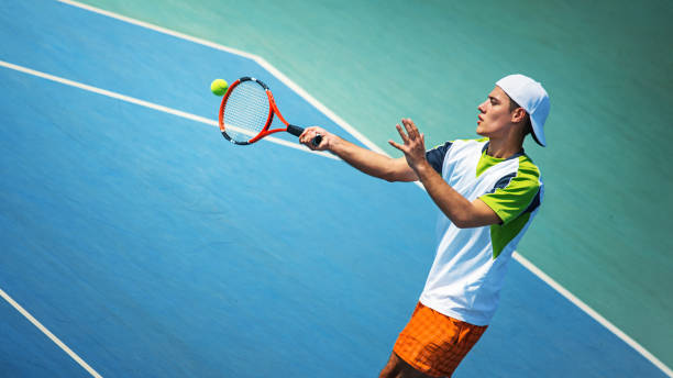 istock Young man playing tennis. 917407390