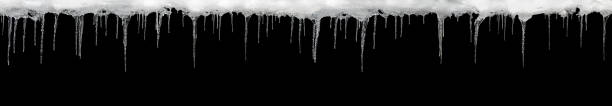 istock Icicles on a black background, wide, space for text, template for design 917408718