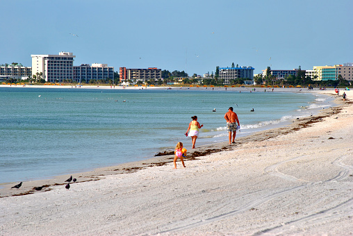 Treasure Island beach, Florida, USA - November 4, 2013: Tourists on Treasure Island beach enjoying the sun on the Gulf coast